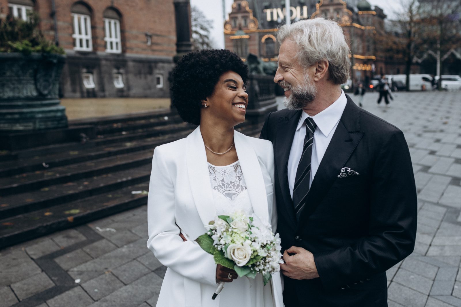 A couple just married, photographed outside Copenhagen City Hall (Rådhus) on the square