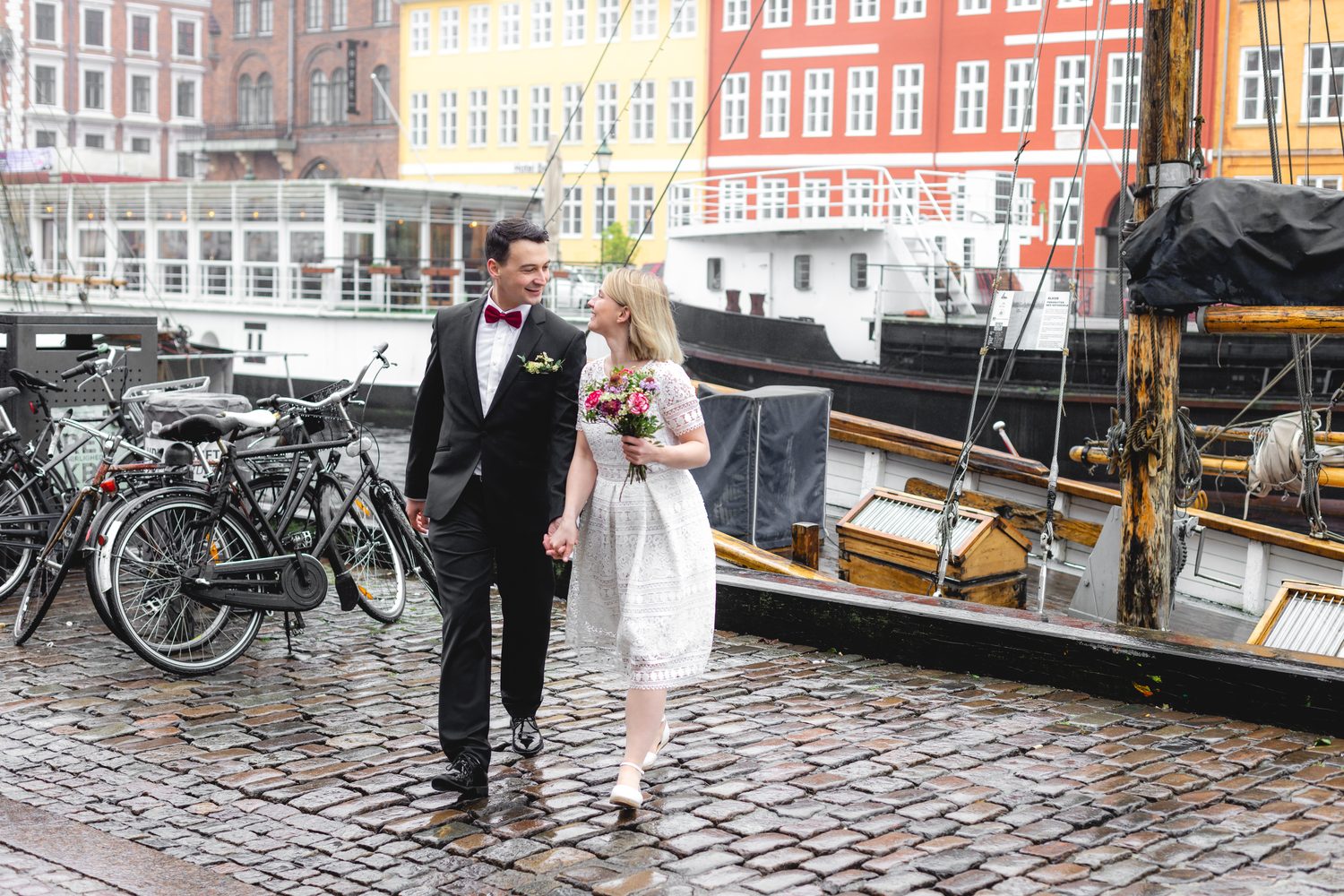 Overcast wedding walk by the Nyhavn boats, Copenhagen