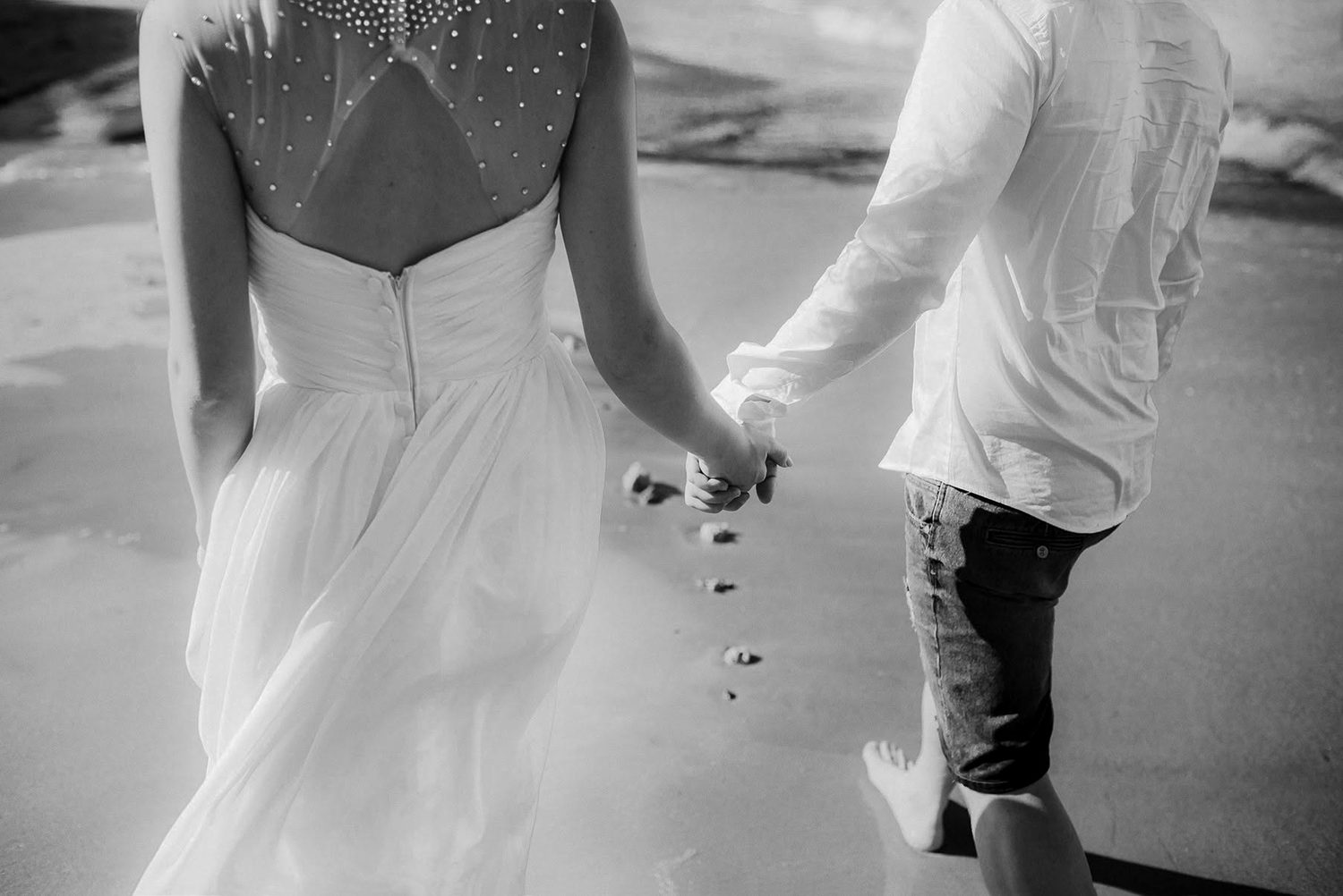 A candid, in-between moment, hand in hand