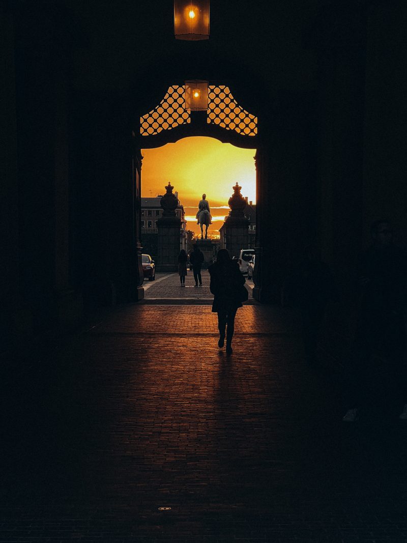 Golden sunset light through an archway at Christiansborg