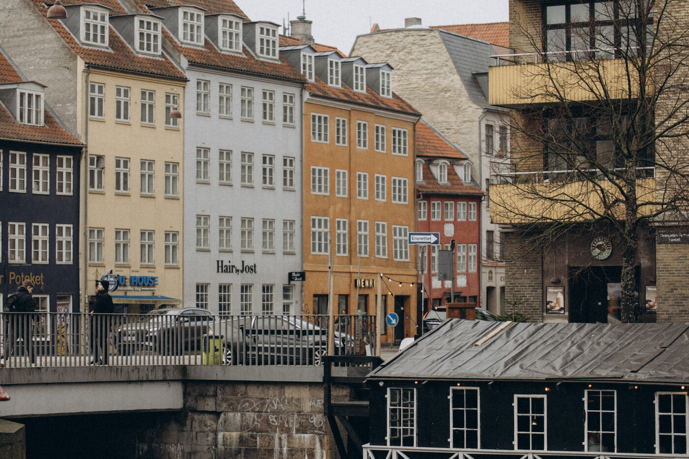 A row of colourful canal houses and a bridge in Christianshavn, Copenhagen