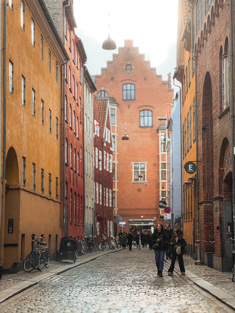 Ochre façades and a stepped gable on Magstræde