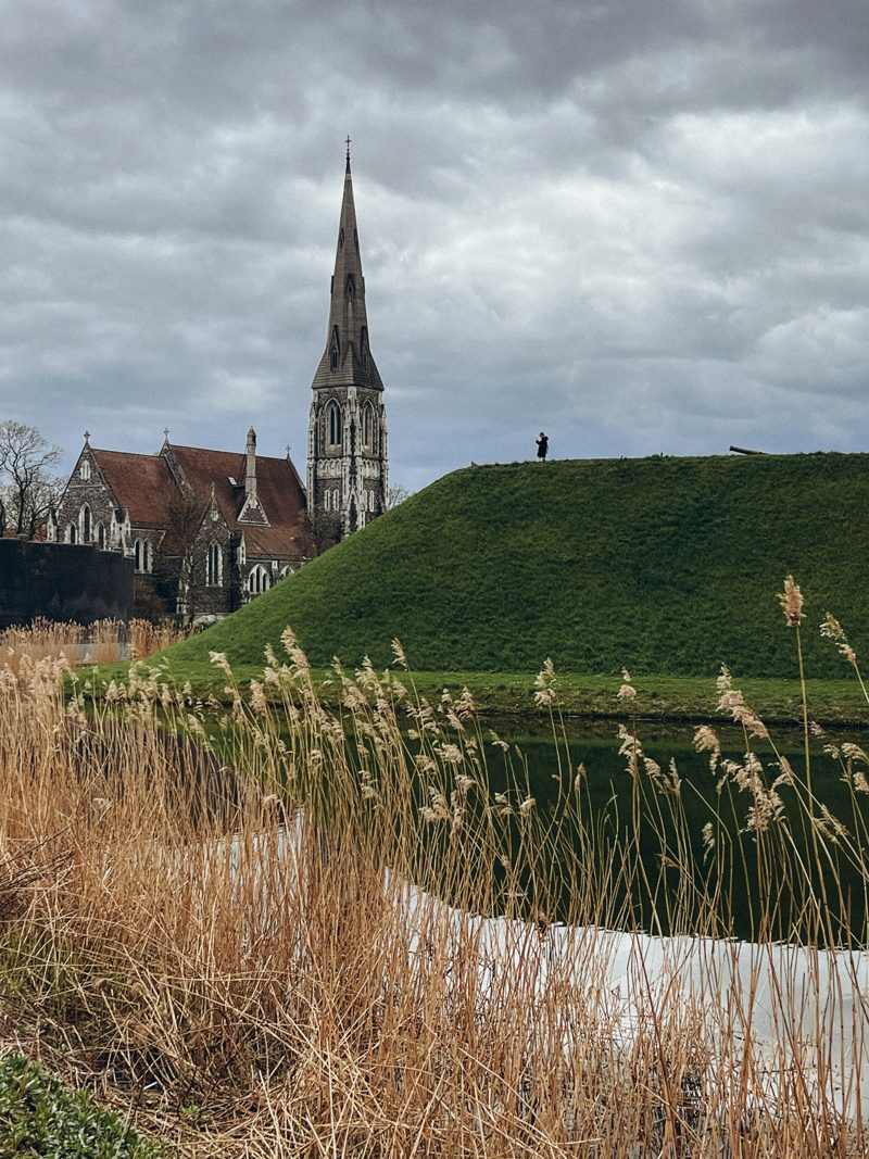 The green ramparts of Kastellet with the church spire beyond