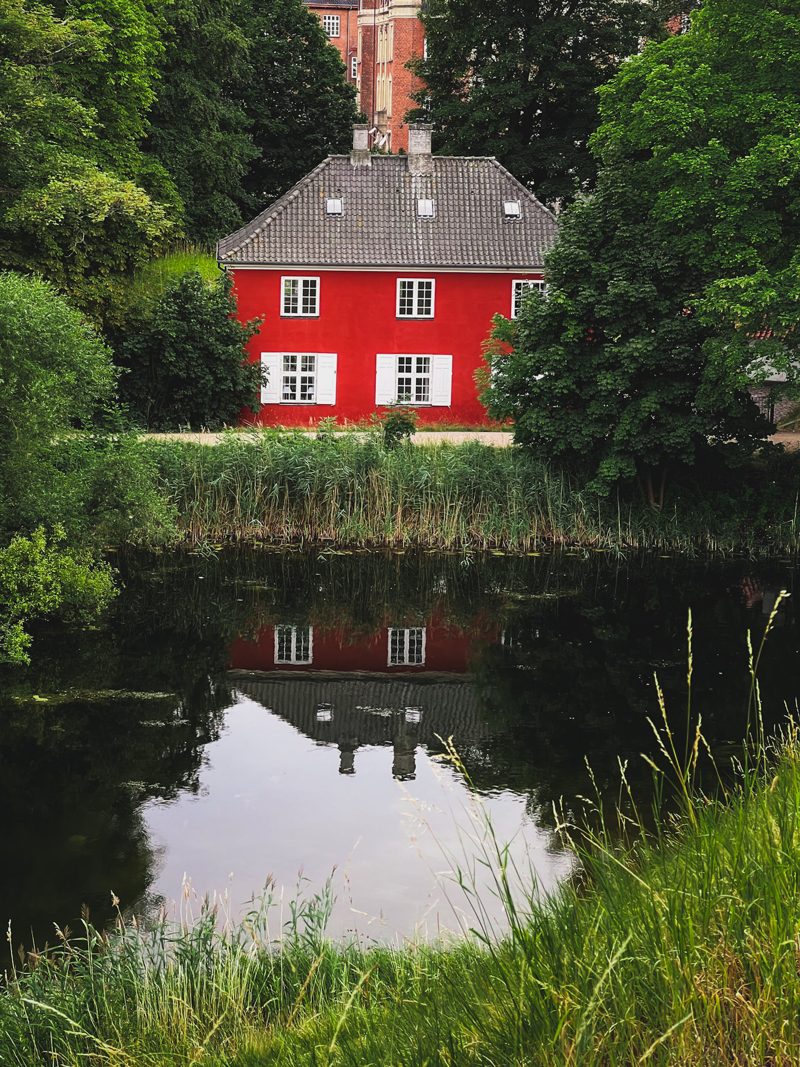 A red house mirrored in the Kastellet moat