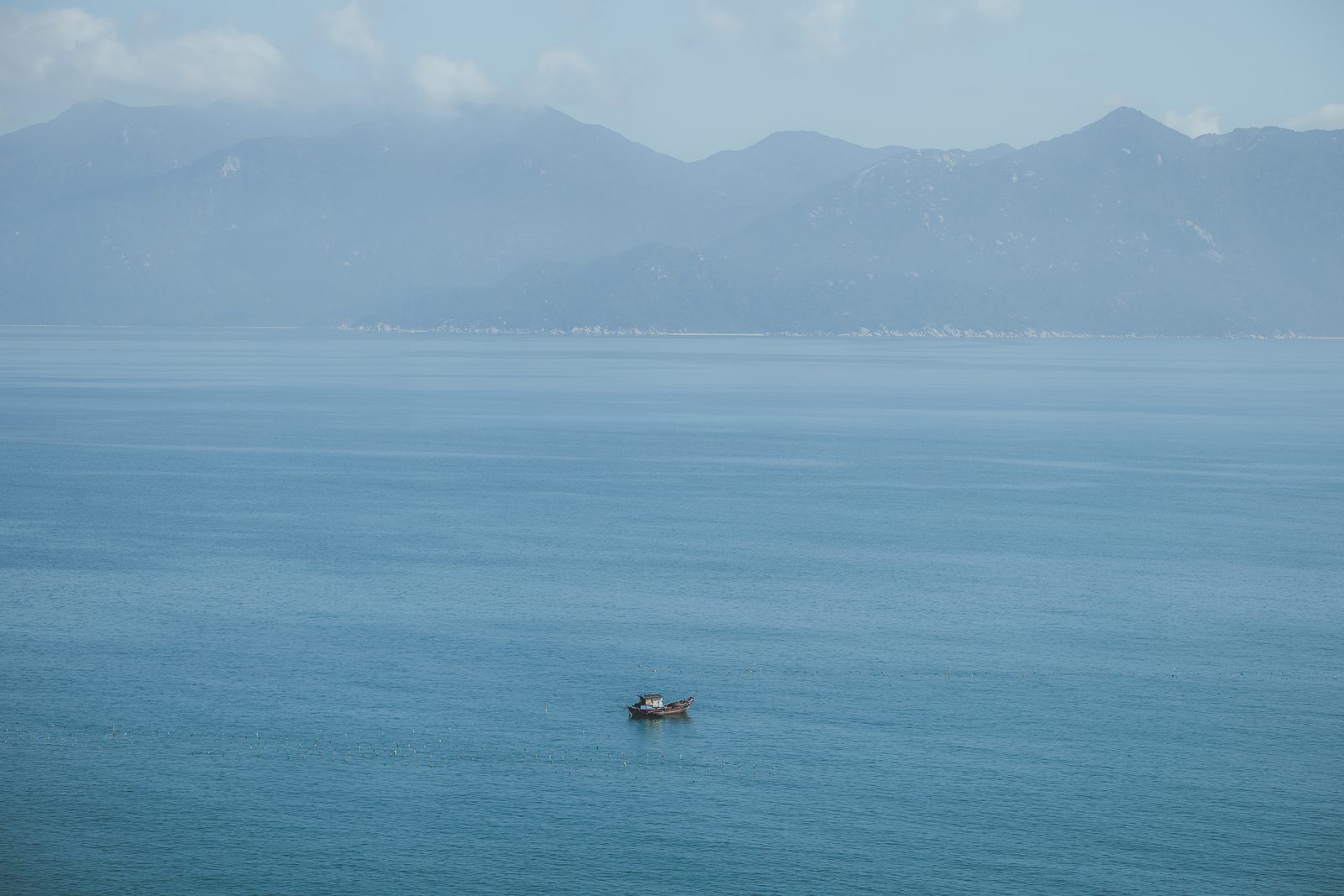 A lone boat on the open blue sea, Vietnam