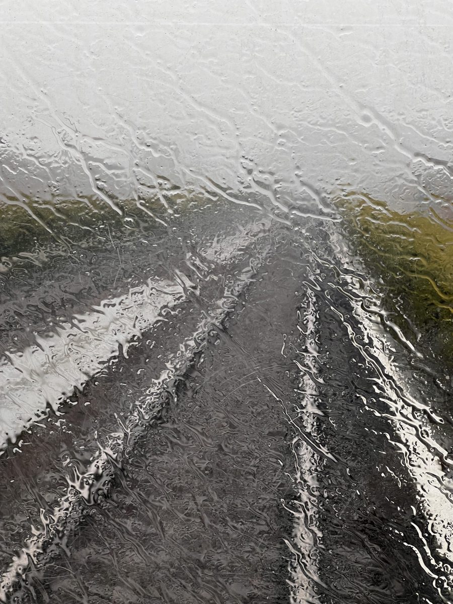 Rain on the window over passing fields, Denmark